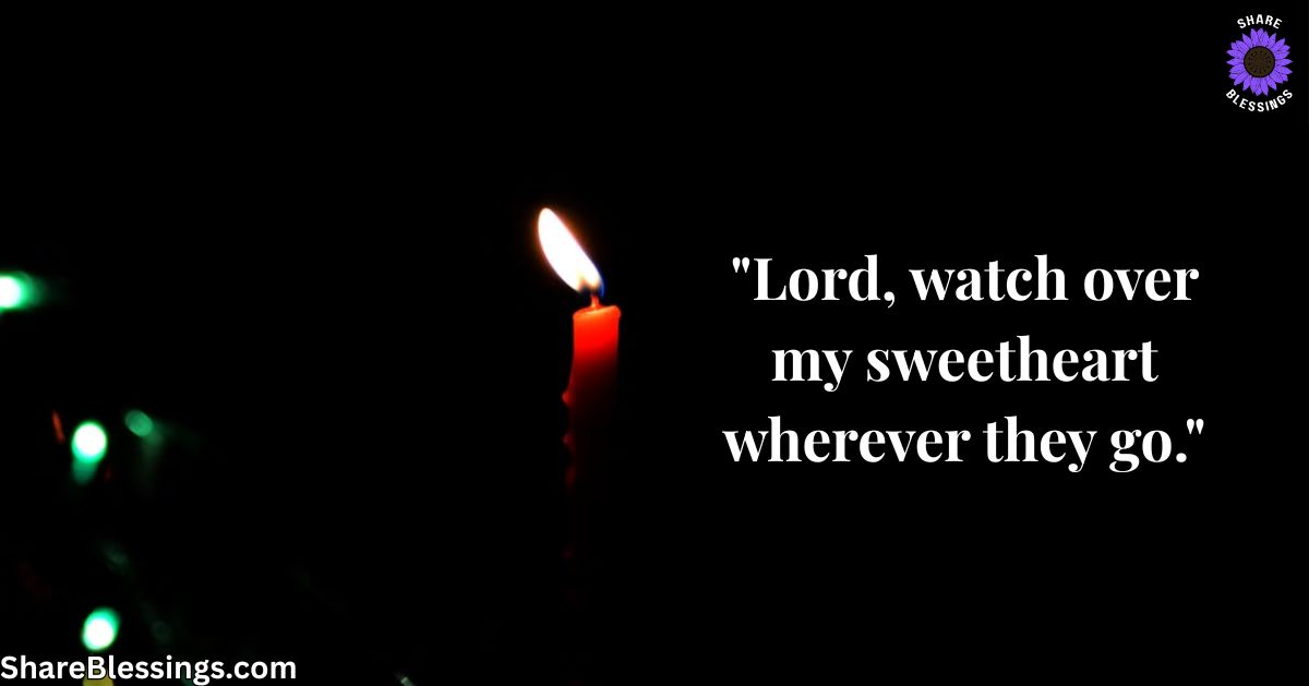 A single candle glowing in a dark room